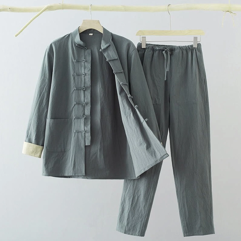 Side profile of men's Tang suit showing shirt silhouette and pants fit with mandarin collar design