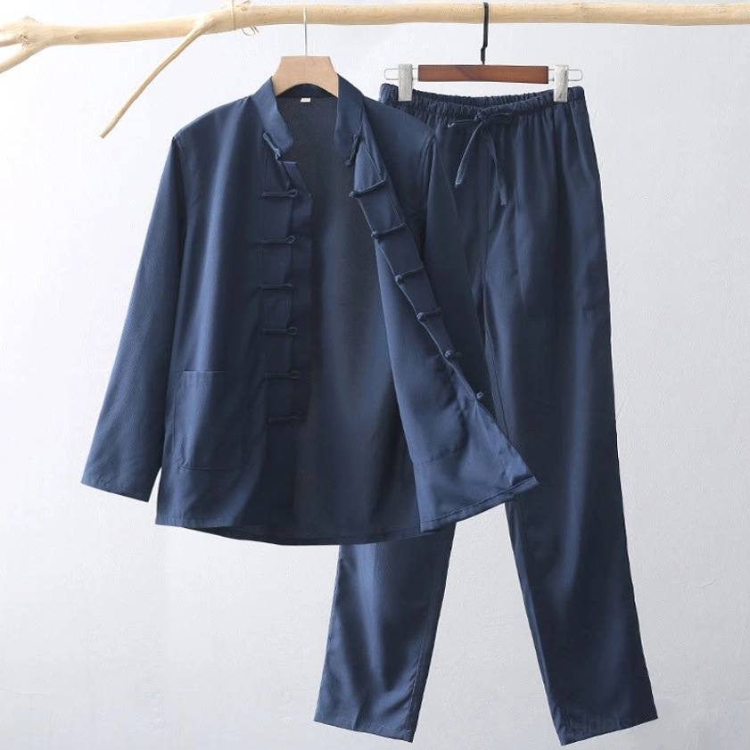 Men's traditional tang suit two-piece set with frog button front closure displayed on clothing rack - front hanging view