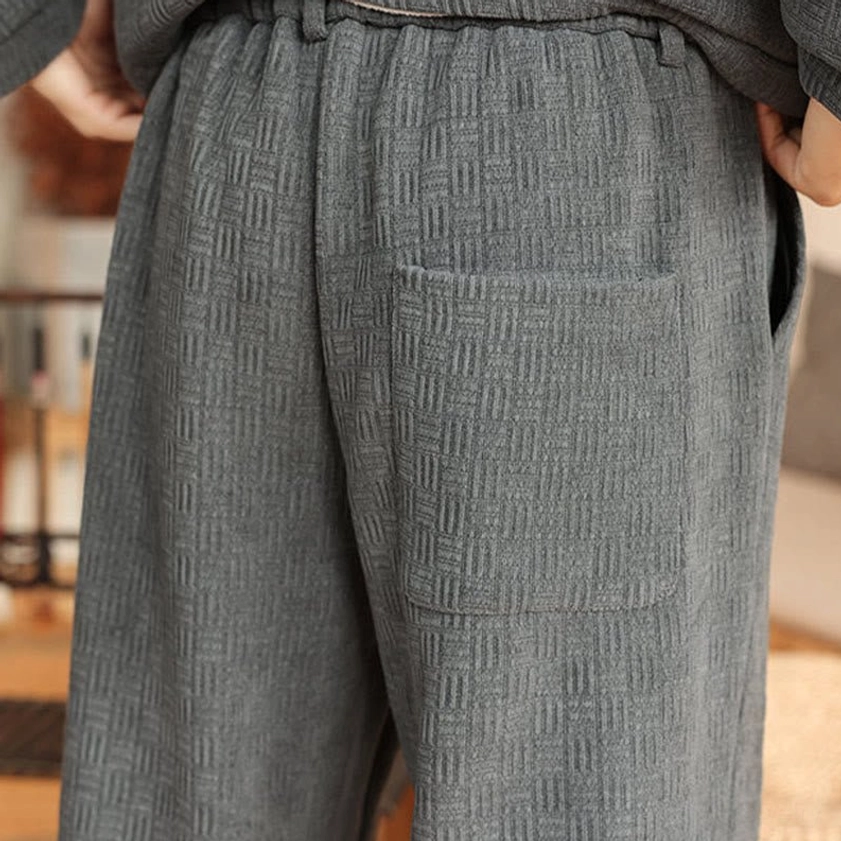 Men's traditional Tang suit jacket and pants, front view detail showing waistband and trouser design