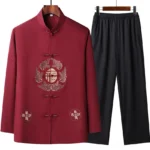 Men's wine red embroidered Tang suit set with mandarin collar and frog button closure, front hanging display showcasing traditional Chinese craftsmanship