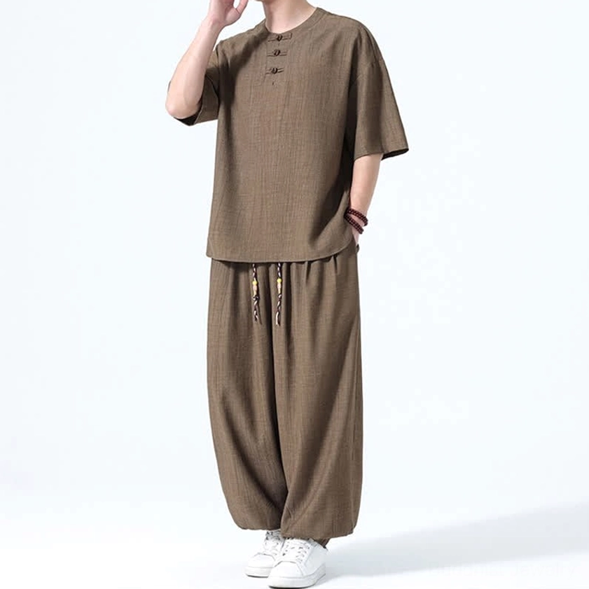 Men's relaxation set front full body brown color with raised hand showing relaxed silhouette