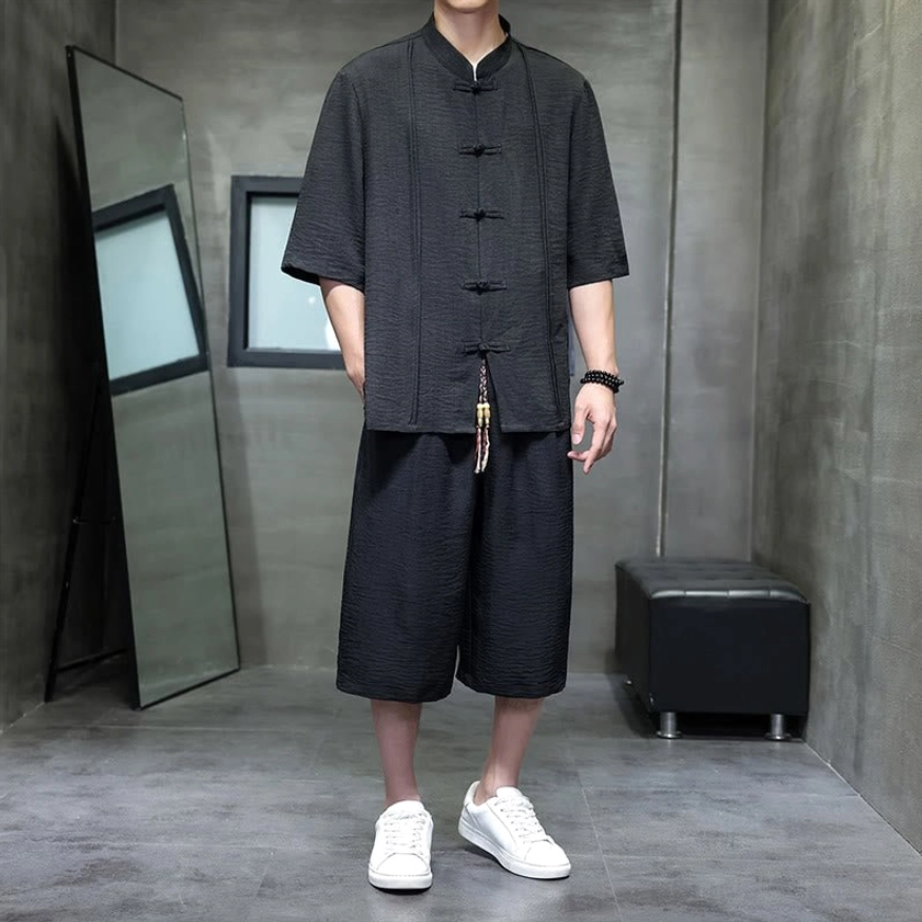 Men's zen meditation tang suit in black color option with frog buttons and mandarin collar