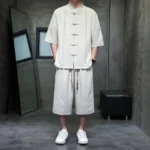 Men's zen meditation tang suit full front view with mandarin collar and frog buttons in beige linen blend fabric