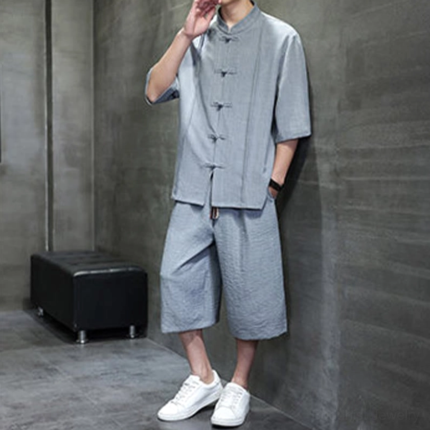 Detail of men's two-piece meditation suit with elbow-length sleeves and cropped pants length