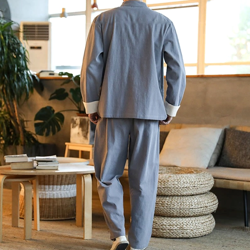 Back view of men's Zen Tang suit set showing plain relaxed fit trousers in gray fabric