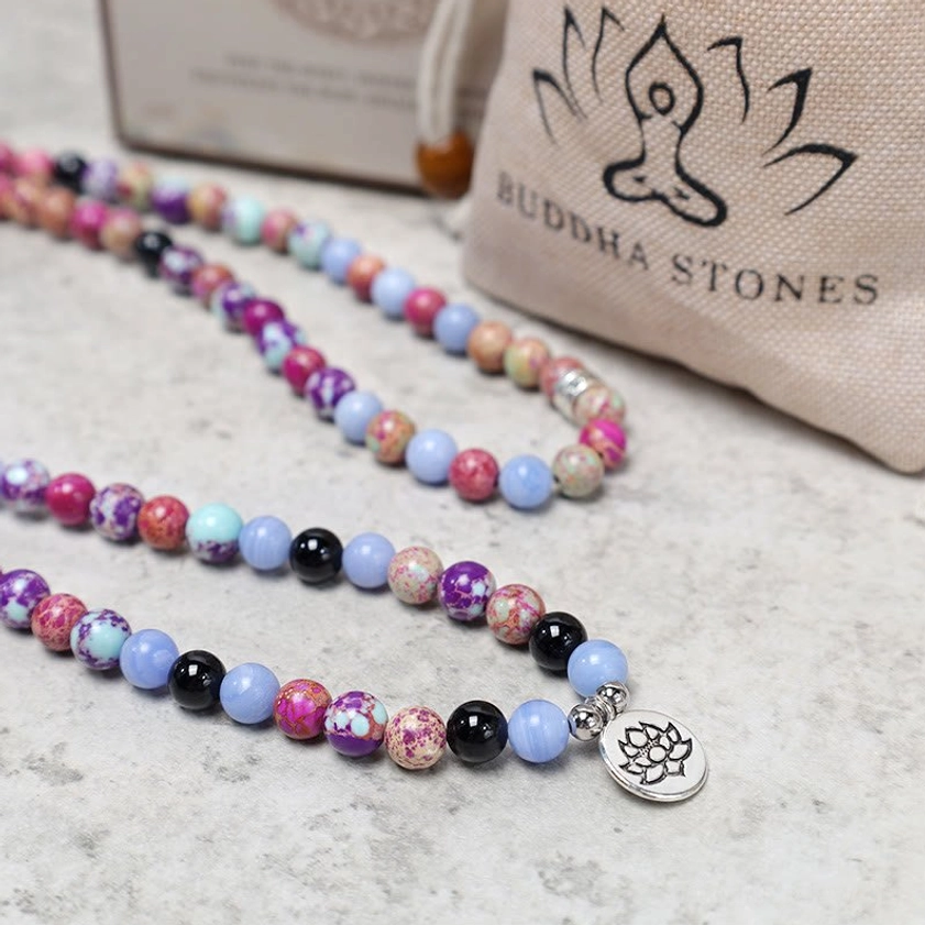 Purple Miano stone lotus mala with branded BUDDHA STONES canvas storage pouch showing product packaging and presentation