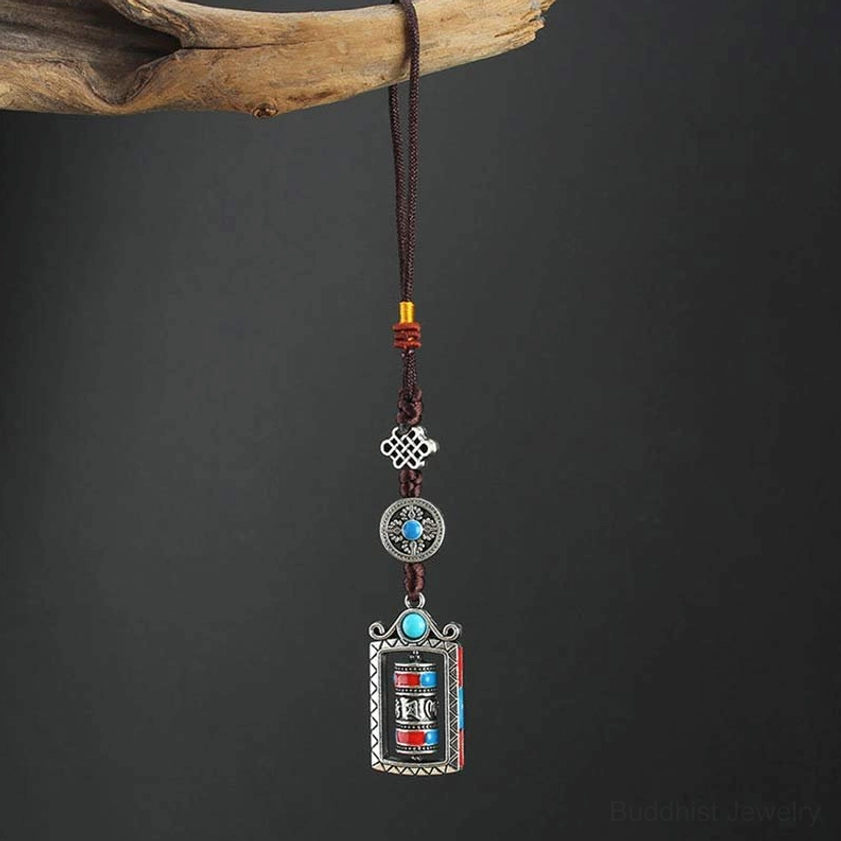 Compact Buddhist prayer wheel ornament hanging with full braided cord and spiritual charm set