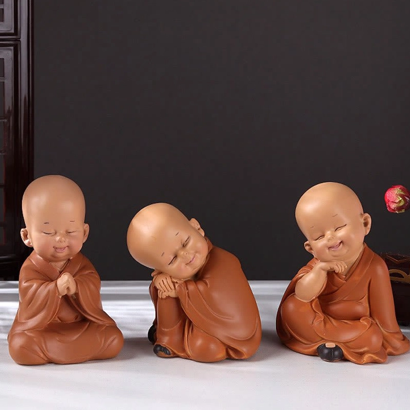 Three unique mini monk figurines with distinct playful poses, terracotta resin Buddhist home decoration set