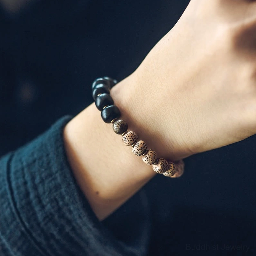 Mixed bead Buddhist peace bracelet with square wood bodhi seeds and brass spacers overhead view