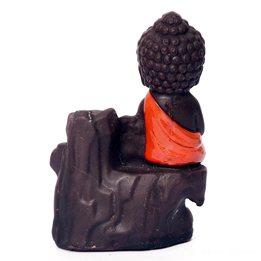 Rear view of monk backflow incense burner on white background showing back sculpture and waterfall design