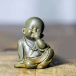 Laughing Monk Covering Mouth Cast Resin Statue with Prayer Beads - Iron Powder Handcrafted Meditation Figurine