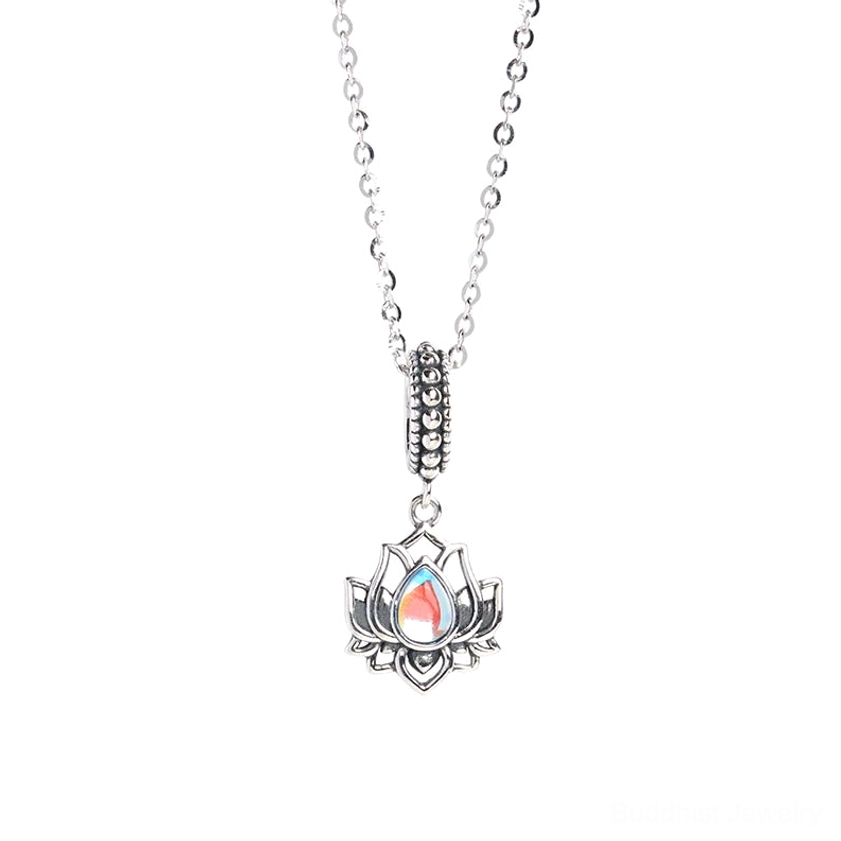 Front view of sterling silver lotus moonstone pendant with color-shifting iridescent moonstone and ornate bail on white background