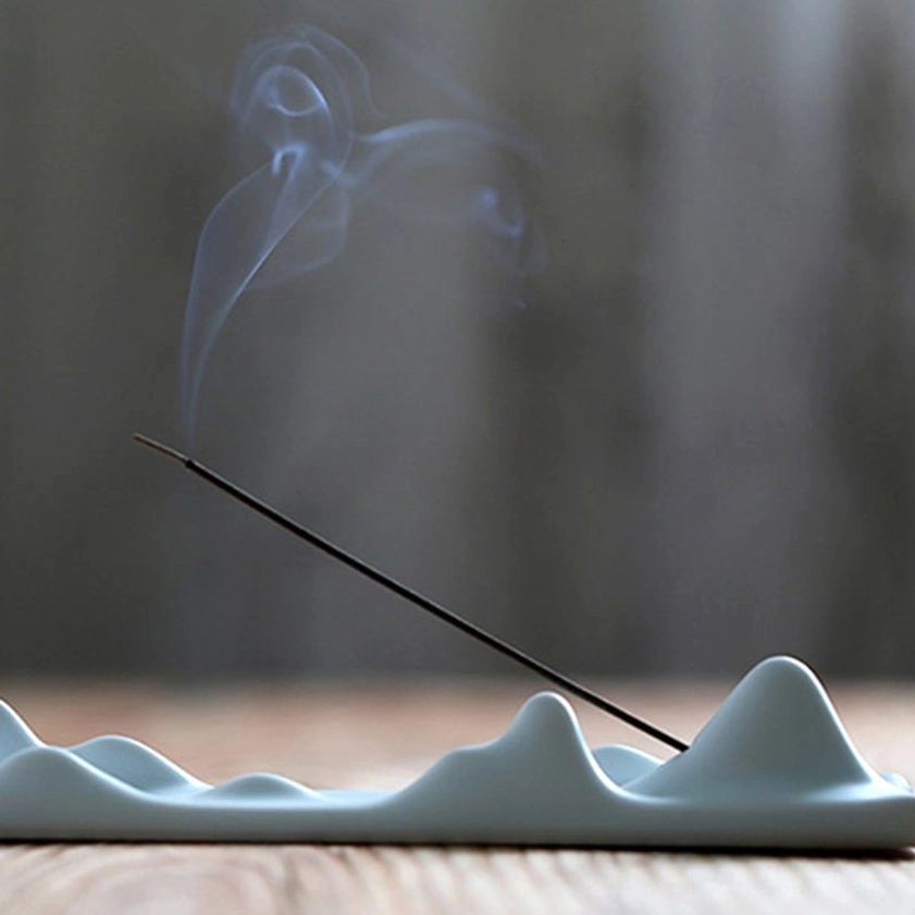 Mountain peak incense holder lifestyle shot showing meditation and mindfulness practice