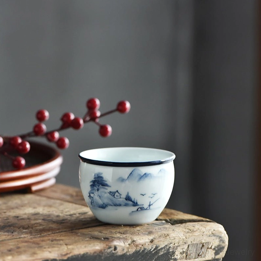 Handmade ceramic gongfu teacup with mountain landscape and architectural elements