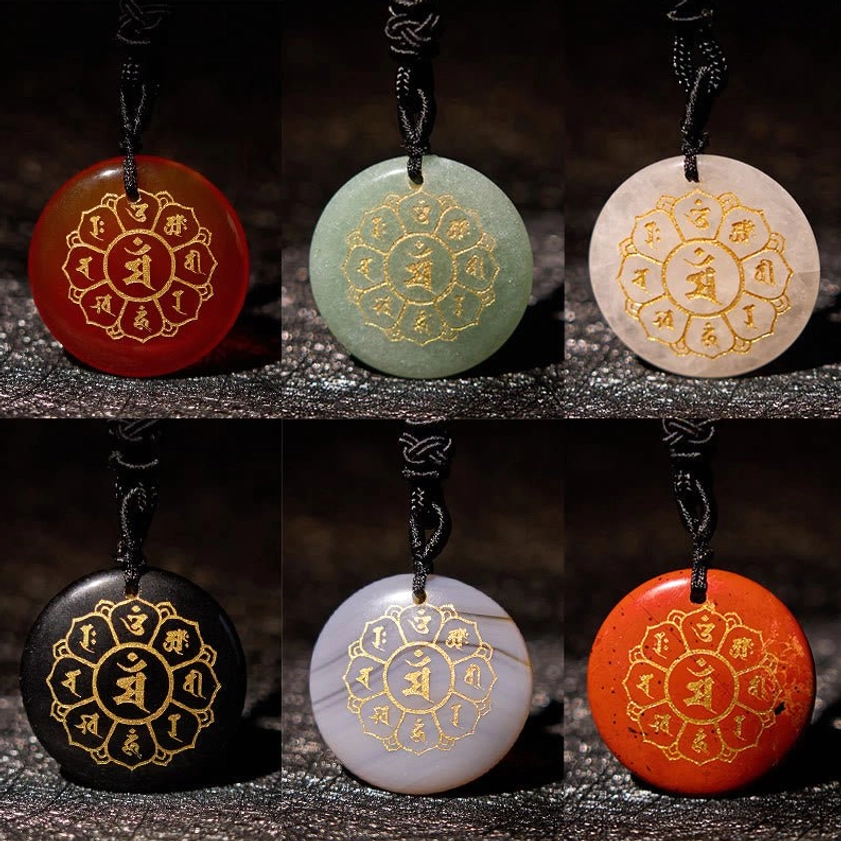 Assorted multi-crystal Buddhist necklace pendants collection featuring Black Obsidian, Red Agate, White Crystal, and Green Aventurine with gold mantra engravings