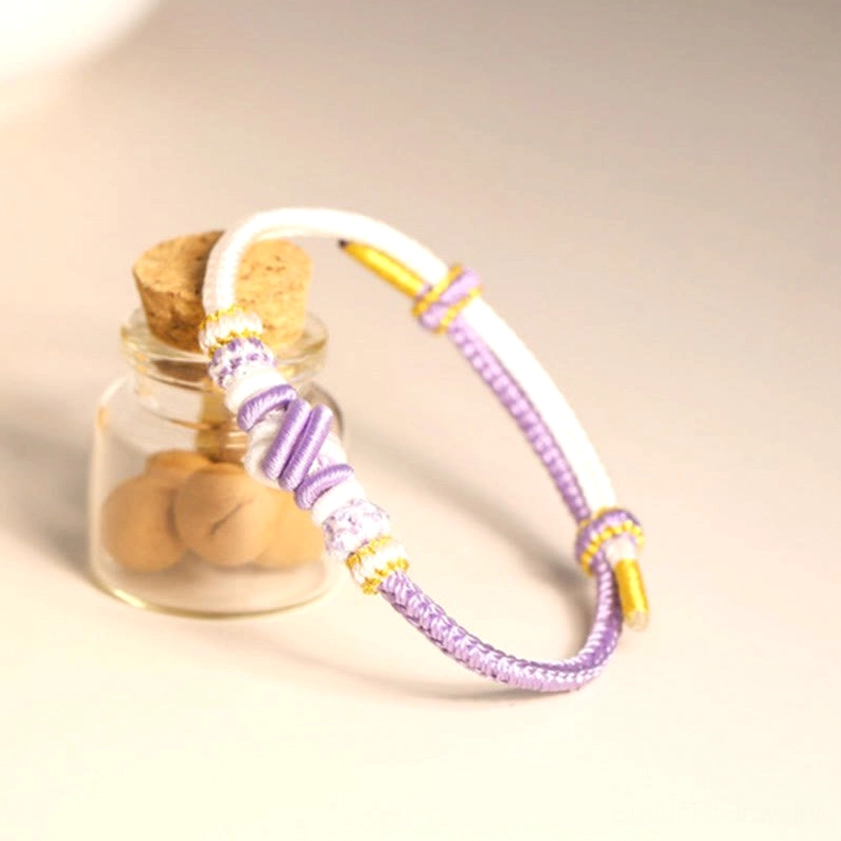 Multicolor braided Buddhist lucky string bracelet showing various color options and peace knot design