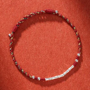 Handmade multicolored braided string bracelet with copper beads for Buddhist protection and spiritual harmony
