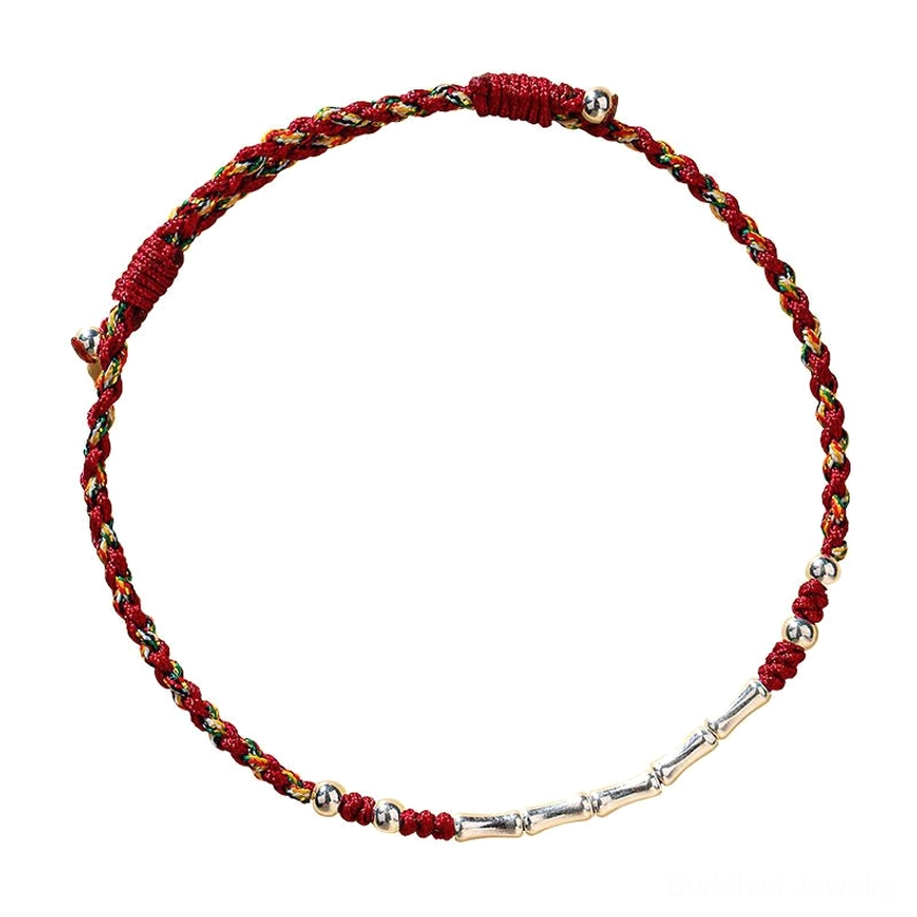 Full view of multicolored woven Buddhist bracelet with metal bamboo ornament accents
