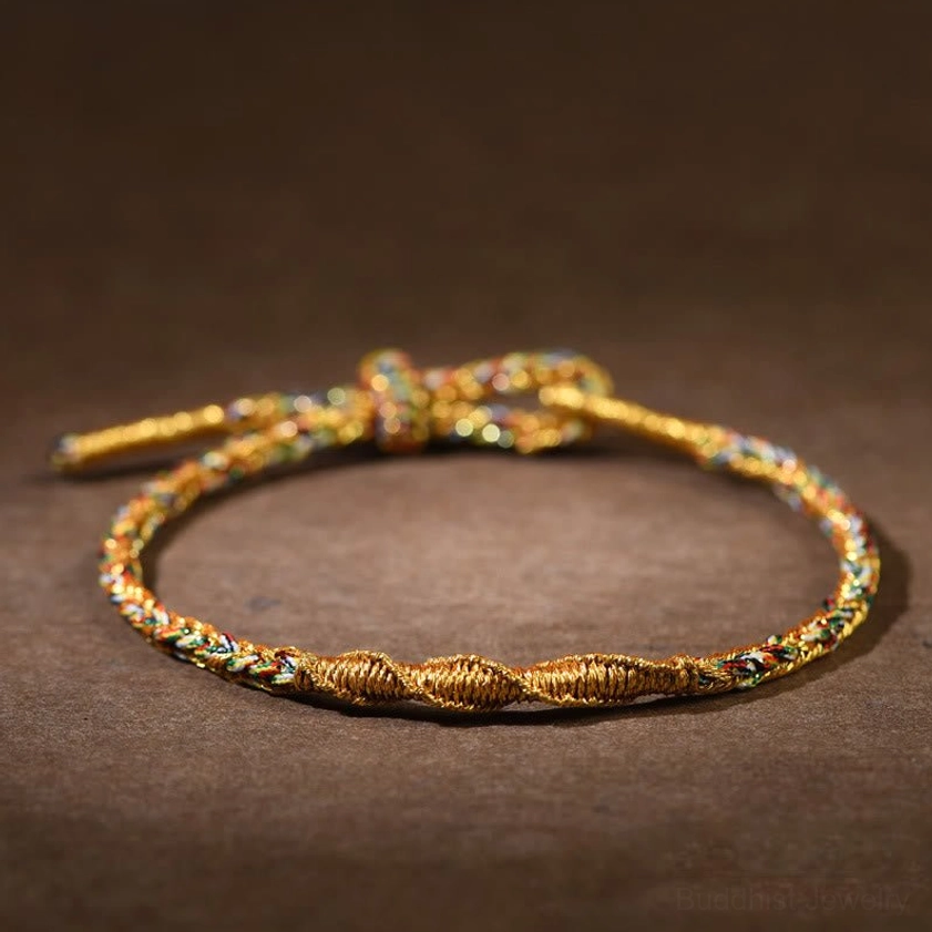 Multicolor Buddhist Zodiac Natal Buddha Braided Bracelets with Gold Accents - Close-up View of Rope Weave and Adjustable Clasp