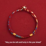 Multicolored Buddhist protection bracelet with King Kong Knot and red five-color thread, featuring 925 silver buckle on solid red background