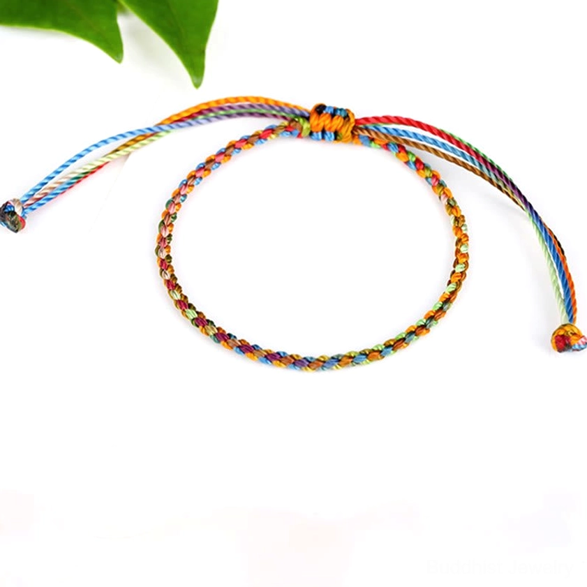 Multicolored Buddhist string bracelet manifesting intention and protection with rainbow silk braid design