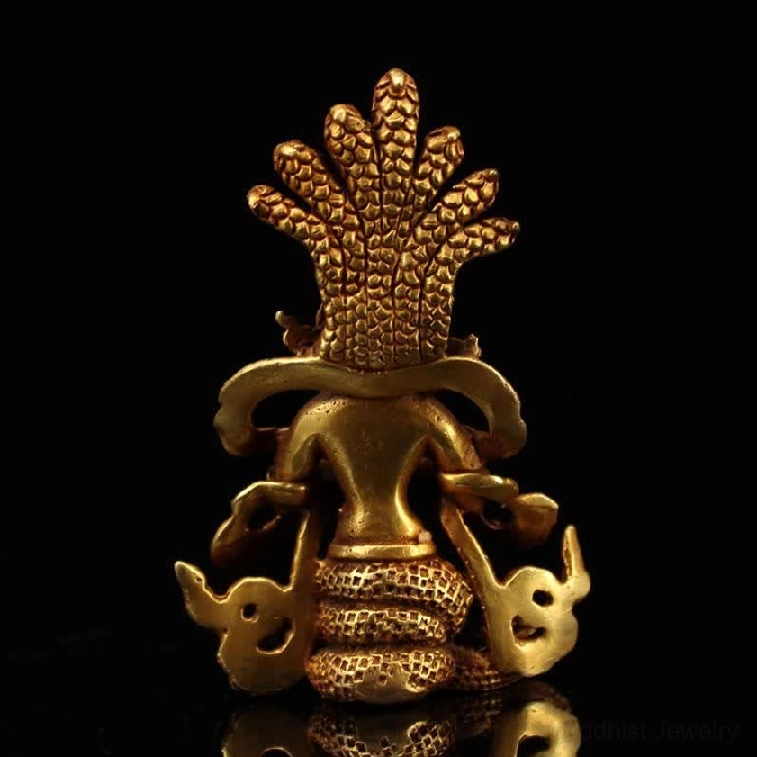 Back view of Nagarjuna Bodhisattva statue showing rear structure, coiled snake tail and cobra crown underside