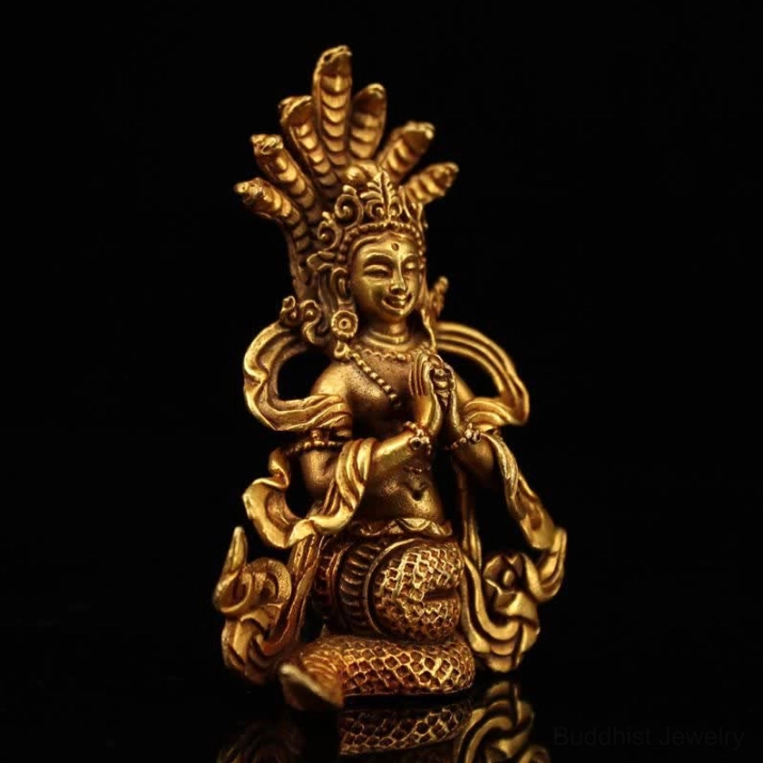 Left side profile of Nagarjuna Bodhisattva brass statue showing ornate crown and seated coiled snake posture
