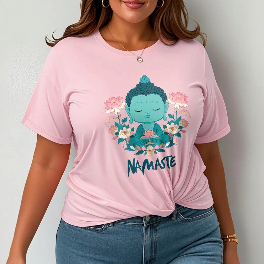 Woman wearing light pink namaste Buddha lotus meditation tee with jeans casual daily outfit relaxed fit