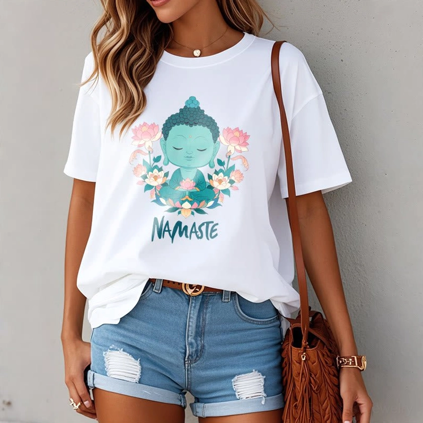 Woman in oversized white namaste Buddha lotus tee with denim shorts casual everyday styling