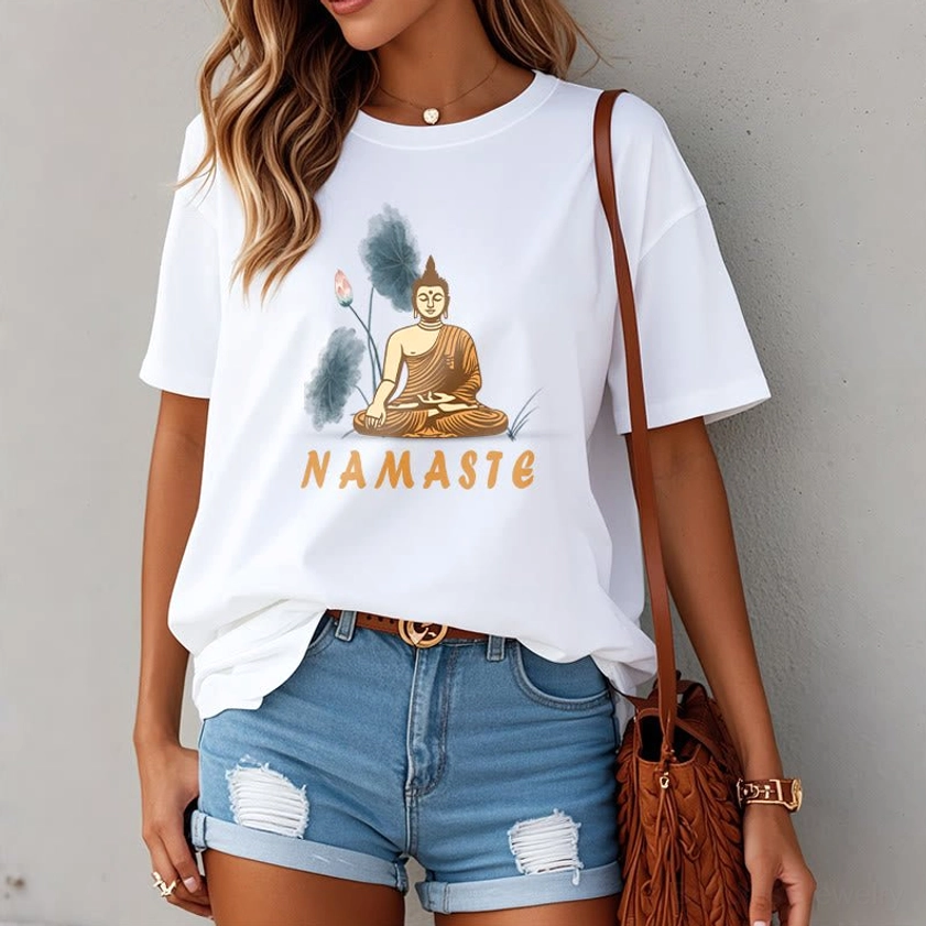 Female model in white Namaste Buddha Lotus T-Shirt paired with denim shorts and leather tote for everyday mindful style