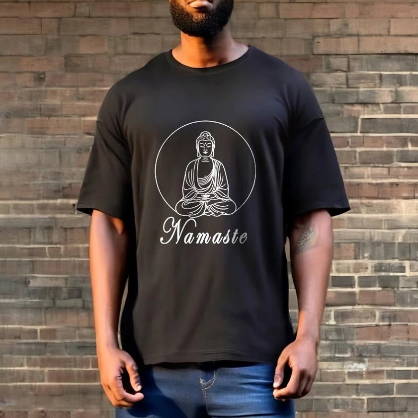 Full body front view man wearing black Buddhist Namaste T-shirt with blue jeans outdoor brick wall setting