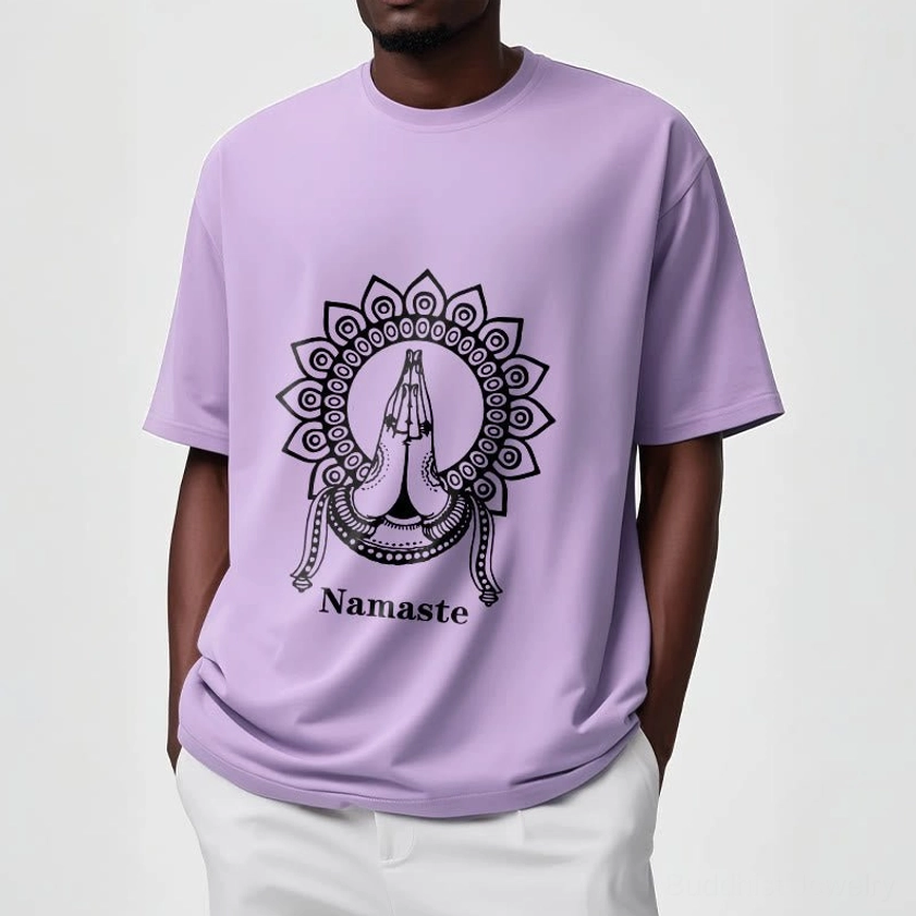 Female model wearing light gray Namaste mandala Buddhist tee on plain light background showing fit and comfort