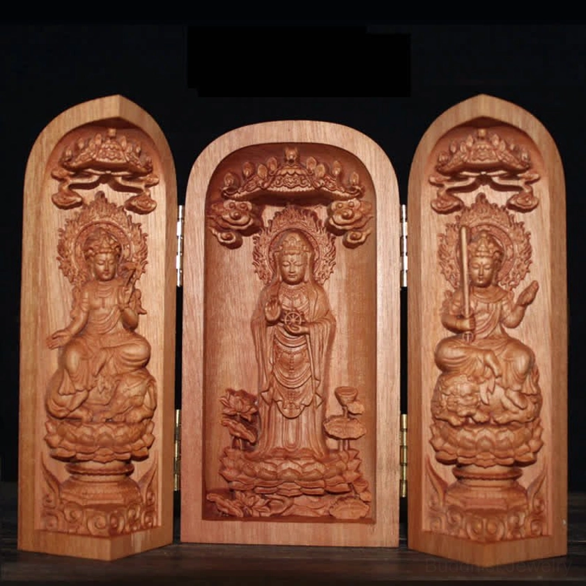 Buddhist altar shrine featuring Nanhai Avalokitesvara Kwan Yin bodhisattva statue with gilded details