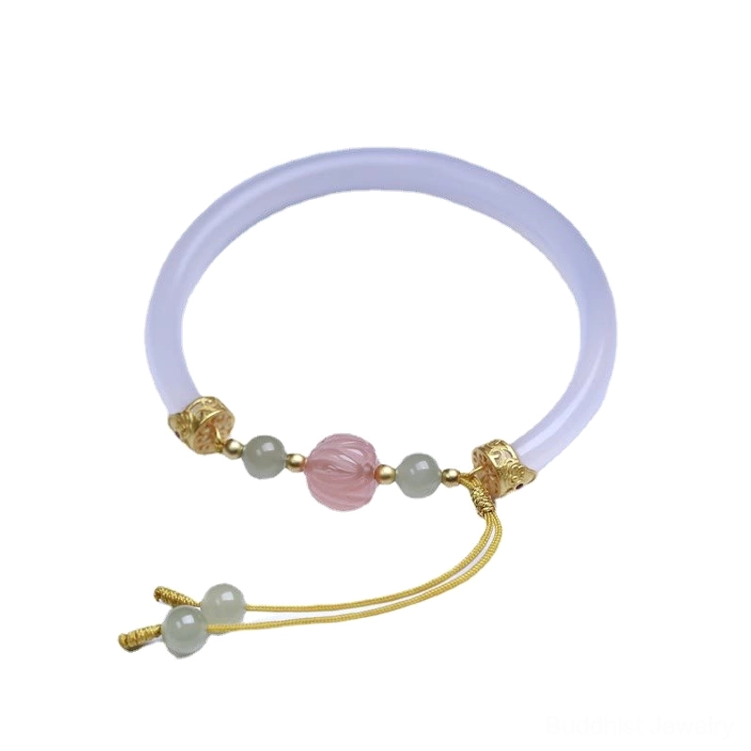 Overhead flat lay of white agate lotus bead bracelet showcasing natural stone texture and colors