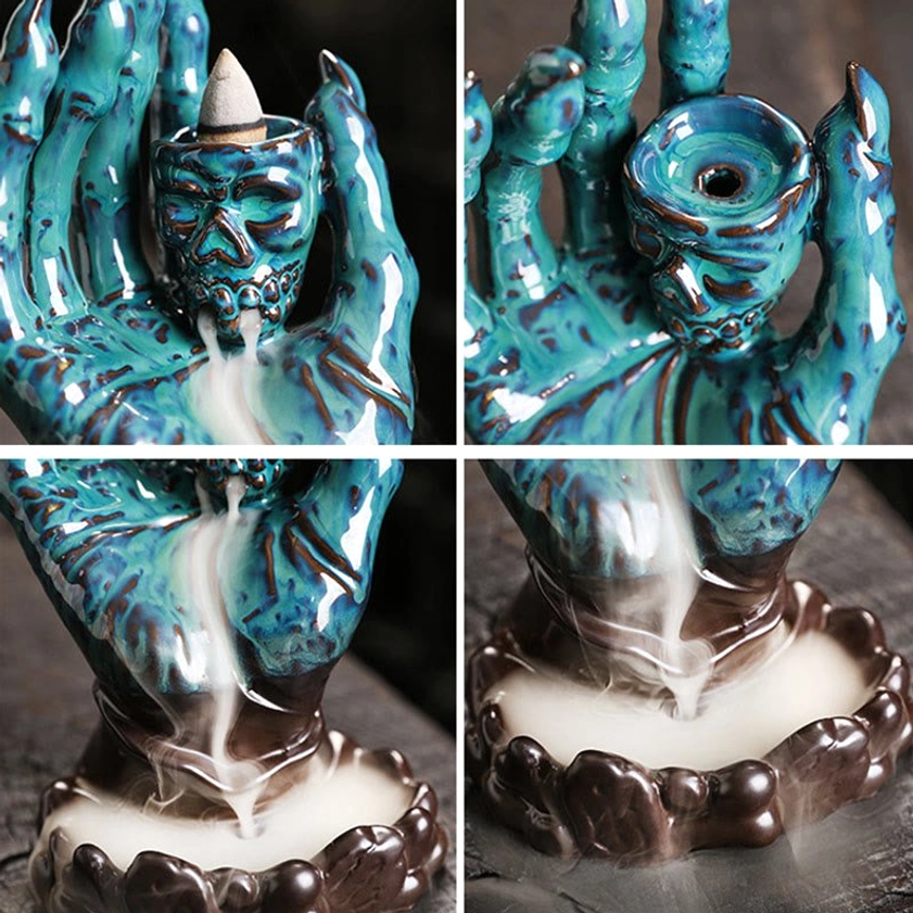 Natural ceramic skull hand backflow incense burner showing craftsmanship and color variations