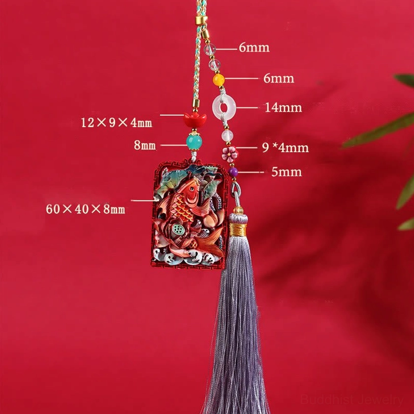 Natural cinnabar lotus koi car hanging decoration with complete beaded cord, tassel attachment, and dimensional carved pendant