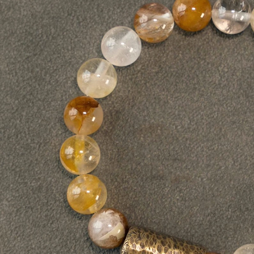 Close-up detail of natural crystal bead texture showing authentic gemstone characteristics