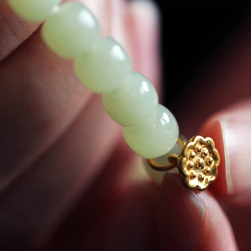 Natural green jade adjustable bracelet with lotus charm for abundance and enlightenment