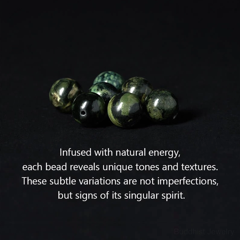 Close-up of individual natural grey jasper beads showing unique color variations and stone texture patterns