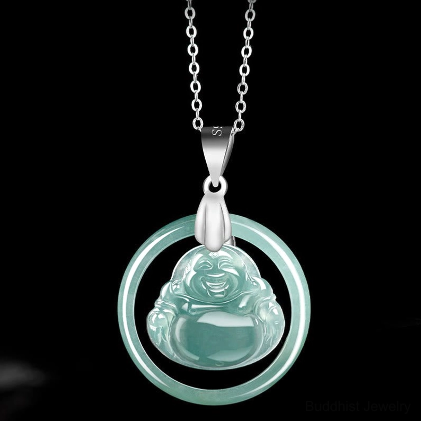 Natural jade Laughing Buddha pendant necklace studio flat lay - green jade charm with silver chain on pure black background