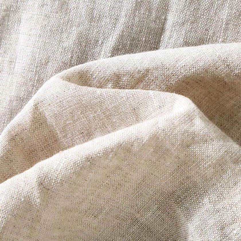 Natural linen fabric texture close-up showing authentic woven material and breathable weave