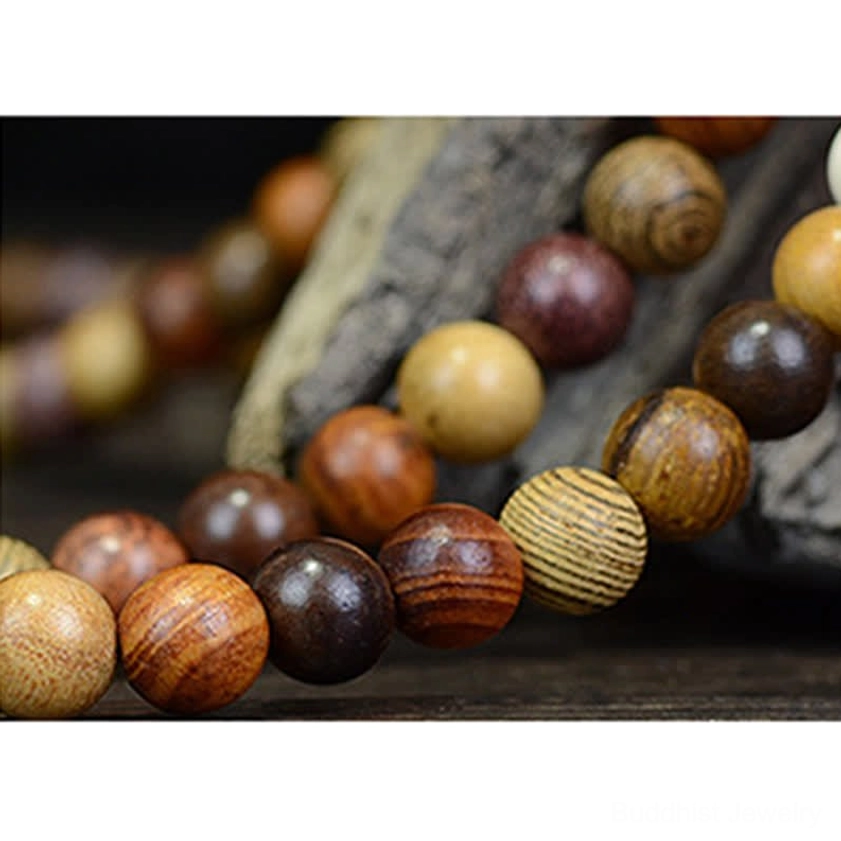 Natural wood 108 bead Buddhist mala necklace with multi-tone wooden beads and silver accent pendants, meditation tool detail view