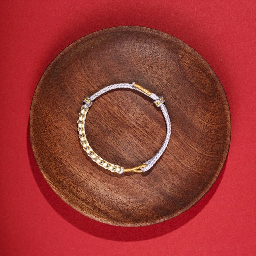 Neutral tone adjustable Buddhist string bracelet with gold metal beads and peach blossom knot weave