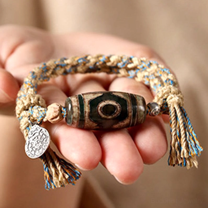Buddhist nine-eye dzi bead bracelet for wealth and spiritual protection with authentic hand-painted beads