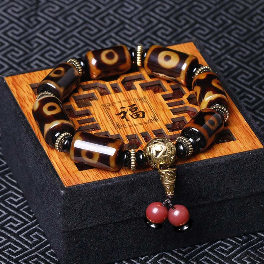 Nine-eye dzi bead bracelet displayed on wooden gift box with fu character, featuring brown-black agate beads and bronze metal accents