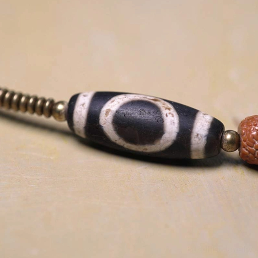 Hand-Painted Nine-Eye Dzi Bead Close-Up - Ancient Protective Amulet with Brass Spacers