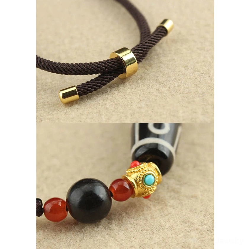 Nine-Eye Dzi Bead Buddhist necklace pendant close-up showing intricate natural agate stone patterns and spiritual symbolism