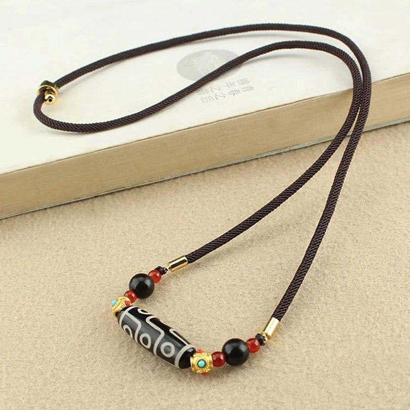 Nine-Eye Dzi Buddhist pendant necklace with minimalist design and coordinated color-block natural stone beads