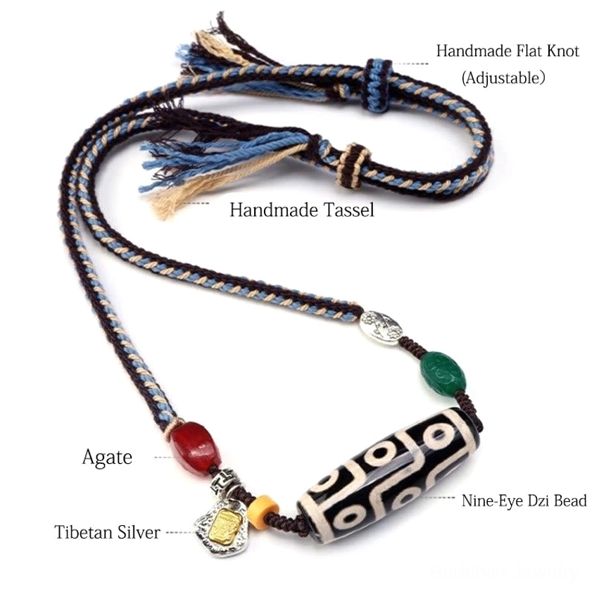 Nine-eye dzi bead Buddhist necklace flat lay showing labeled components including natural agate bead, Tibetan silver charm, adjustable knot fastening, and woven braided rope