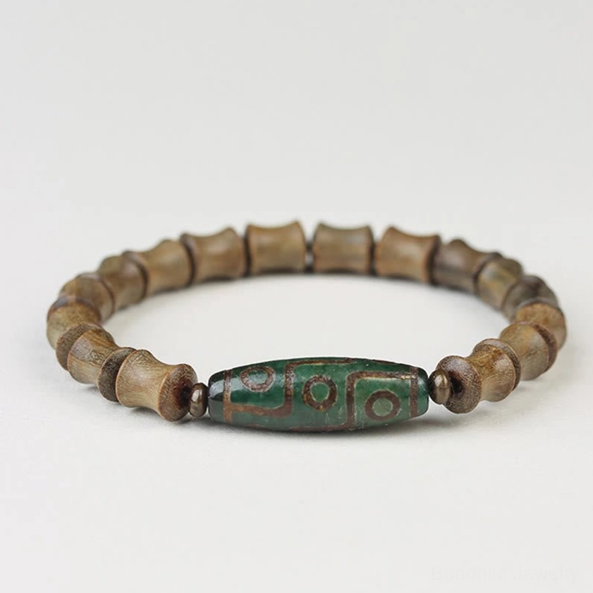 Green sandalwood and nine-eye dzi Buddhist bracelet styling suggestion with lifestyle context